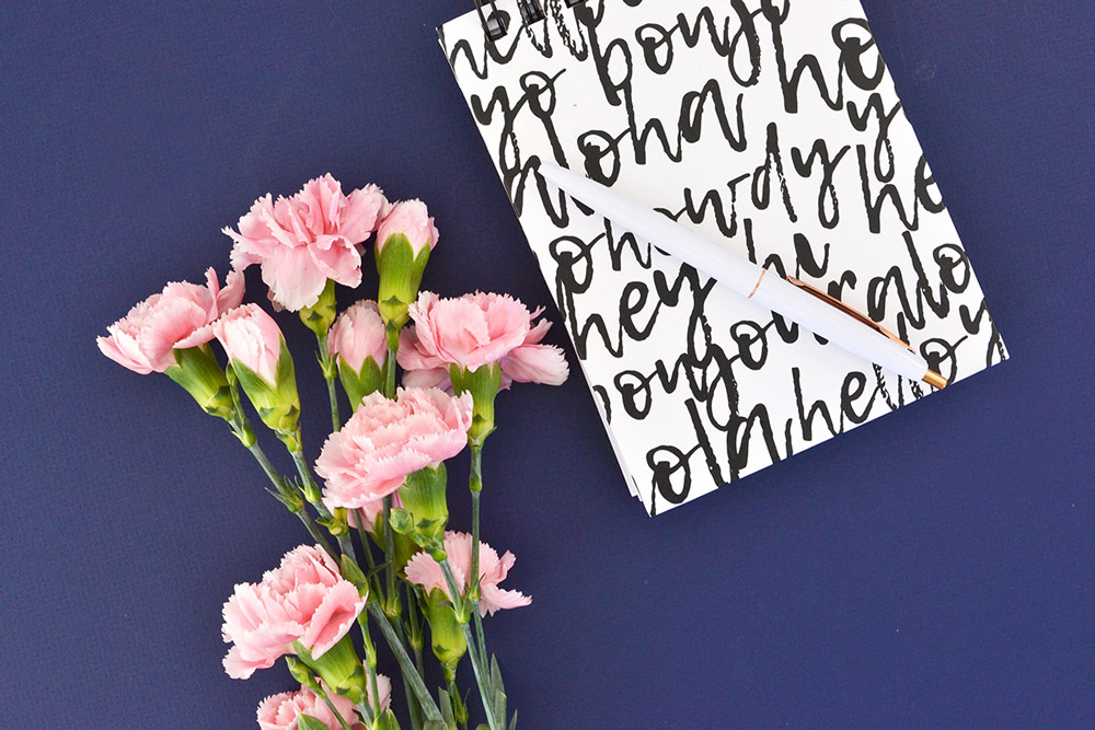 Multilingual notebook with pink flowers